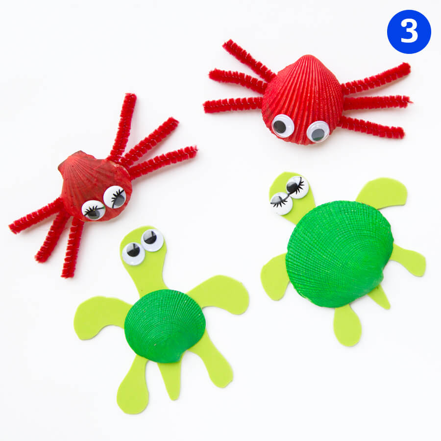 Painted shells and pipe cleaner in the shape of crab and turtle